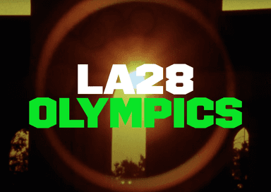 LA Olympic Memorial stadium in background with lens flare and LA28 Olympics custom typeface by by MCKL / Jeremy Mickel.
